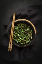 Fried bean pods, in soy sauce, with sesame seeds, homemade, no people