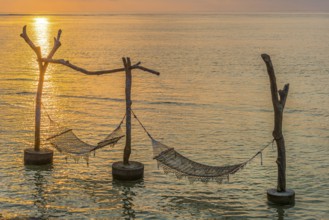 Hammock in the sea water in front of the holiday island Nusa Lembongan, beach, beach holiday, beach