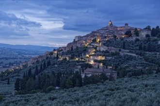 Trevi, illuminated at dusk, is a small Italian town in the province of Perugia in Umbria and a