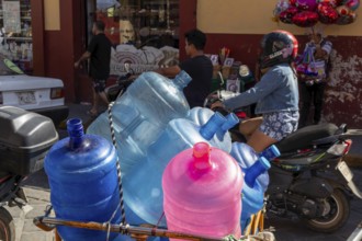 Oaxaca, Mexico, Empty potable water bottles on a cart. They will be refilled and returned to users,