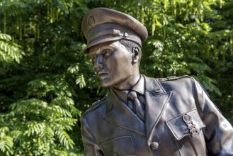 Bronze statue, monument to rock singer Elvis Presley, King of Rock 'n' Roll in uniform of the 3rd