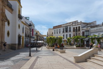 Picturesque Spanish street with historic buildings and relaxed atmosphere, Plaza del Socorro, Old