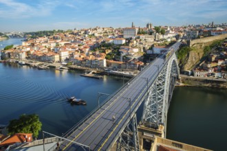 View of Porto city and Douro river and Dom Luis bridge I with metro tram from famous tourist