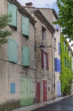 House facades with colourful window and door shutters, Vauvenargues, place of work of Pablo Picasso