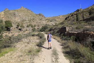 Woman walking in Sierra Alhamilla mountains, Nijar, Almeria, Spain, Europe