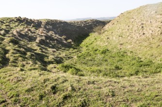 Defensive ditch and rampart at Barbury Castle Country Park, Iron Age hill fort, Wiltshire, England,