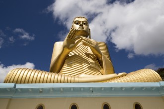 Giant Golden Buddha statue at Dambulla cave temple complex, Sri Lanka, Asia