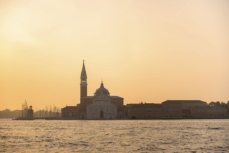 View over the water to the church of San Giorgio Maggiore, at sunrise, Venice, Veneto, Italy,