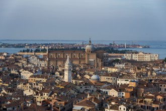 View over the roofs of Venice to the church Basilica dei Santi Giovanni e Paolo in the evening