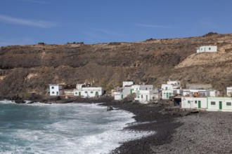 Puertito de los Molinos, beach, waves, several small white houses, west coast, Fuerteventura,