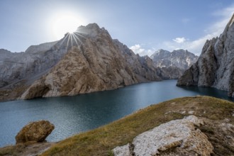 Mountain lake Kol Suu rocky steep mountains, sun star, Kol Suu Lake, Kurumduk Valley, Sary Beles