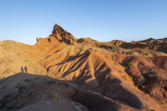 Erosion landscape of red and yellow sandstone, rock formations at sunrise, Skazka Canyon, fairytale