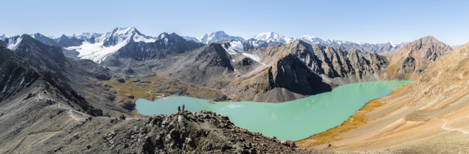 Hiker at the pass at 4000m, aerial view, mountains with glacier, mountain pass and mountain lake