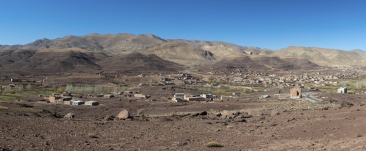 View of Taboulmante with colourful mountains in the background, layered landscape, Gorges du Dades,