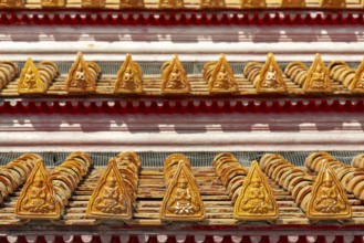 Roof decoration at the Uposatha Hall, Ubosot, the roof is staggered in three tiers and covered with