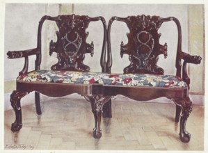 Furniture around the turn of the century 1900, Carved walnut darby and Joan settee (1910, 1911),