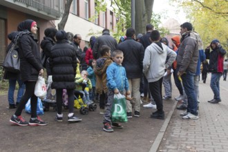 Refugees from Syria waiting to be registered at the Central Reception Centre for Asylum Seekers at