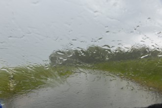 Heavy rain on the Old Post Road near Possendorf in the Eastern Ore Mountains, Possendorf, Saxony,