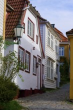 Historic town centre of Bergen with narrow streets and cobblestones surrounded by traditional