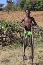 South Ethiopia, among the Benna people, boy on stilts, stilt walker, Ethiopia, Africa