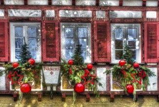 House facade with Christmas decoration, window, window shutters, half-timbered, Christmas motif,