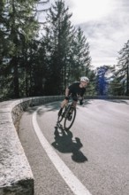 Road bike rider in spring between Lechtal and Tannheimer Tal in front of picturesque scenery of the