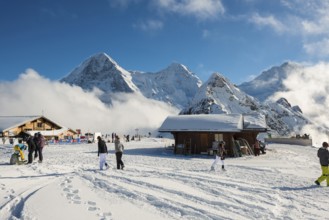 Wooden chalet and ski slope, with views of the Eiger, Mönch and Tschuggen, Grindelwald, Bernese