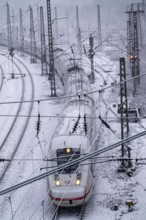 Winter weather, heavy snowfall, railway tracks in front of Essen main station, ICE train, North