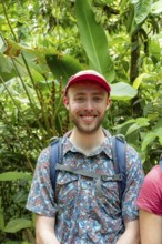 Tourist in the tropical rainforest, portrait, Corcovado National Park, Osa Peninsula, Puntarena