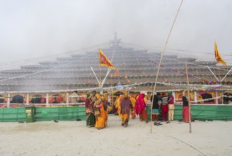 Devotees offer prayers at a makeshift Havan place on the eve of consecration ceremony of the Ram