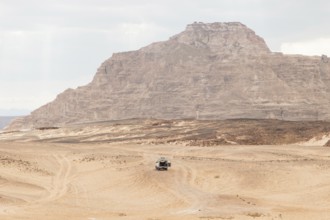 Desert, red mountains, rocks and cloudy sky. Egypt, color canyon, the Sinai Peninsula, Dahab