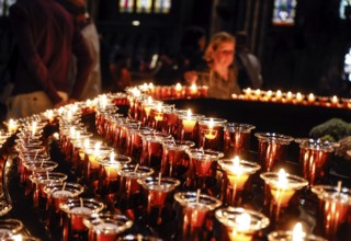 Candles glow in Freiburg Minster, Freiburg im Breisgau, 23 May 2023