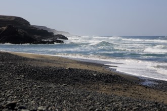 Waves breaking on beach at Playa de Garcey, Fuerteventura, Canary Islands, Spain, Europe