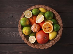 Assortment, citrus fruits, in a basket, close-up, top view, no people