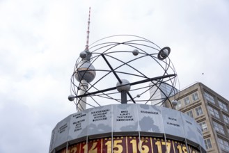 The World Time Clock on Alexanderplatz with the Berlin TV Tower in the background, Berlin, Germany,