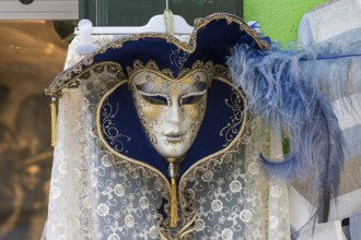 Venetian carnival mask in front of a shop, Burano, Veneto, Italy, Europe