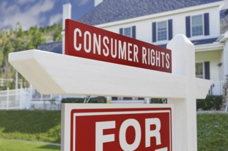 Consumer rights for sale real estate sign in front of new house