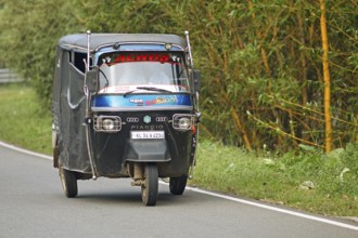 Traditional tuk tuk on the road, Thekkady, Kerala, India, Asia