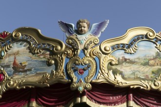 Deatil of an angel on a historical carousel, Rome, Italy, Europe