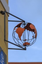 Globe as nose sign of a travel agency, Sulzbach-Rosenberg, Upper Palatinate, Bavaria, Germany,