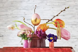 Picturesque still life with flowers and Easter egg, Germany, Europe