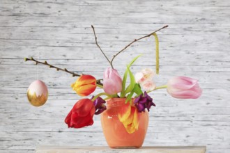 Picturesque still life with flowers and Easter egg, Germany, Europe