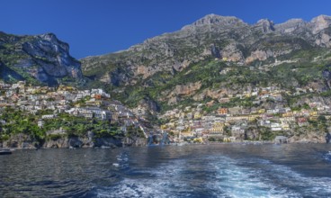 View from the boat of the village on the cliffs above the sea, Positano, Amalfi Coast, Amalfitana,