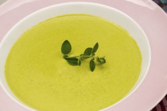 South German cuisine, pea soup, soup arranged in a plate, herbs, savoury, salty, traditional