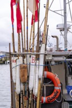 Fishing boats in the town harbour of Sassnitz, island of Rügen, floats of buoys for net marking,