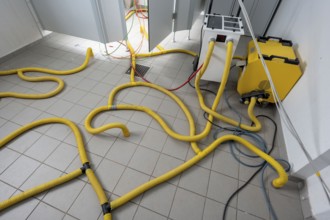 Water damage restoration, dehumidification, after flooding of a building, vacuum drying