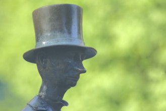 Man with top hat and historical Biedermeier clothing at the Datterich fountain, headgear, hat,