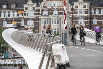 Cyclists on the Lille Langebro cycle and pedestrian bridge over the harbour, Copenhagen is