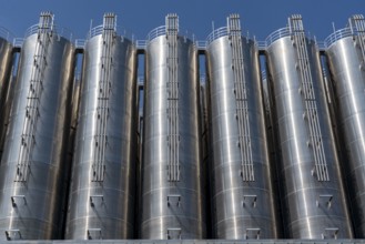 Stainless steel tanks of a large silo facility in Duisburg inland harbour, Duisburg-Neuenkamp, for