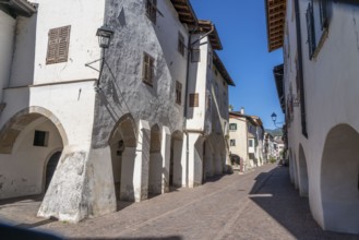 The town of Neumarkt, in the Adige Valley, in South Tyrol, arcades in the old town centre, in front